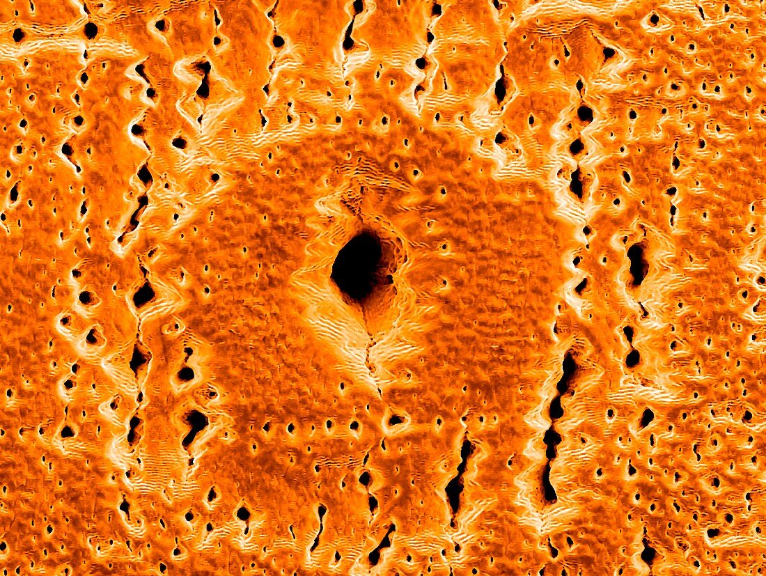 Silver hole formed by a laser, SEM