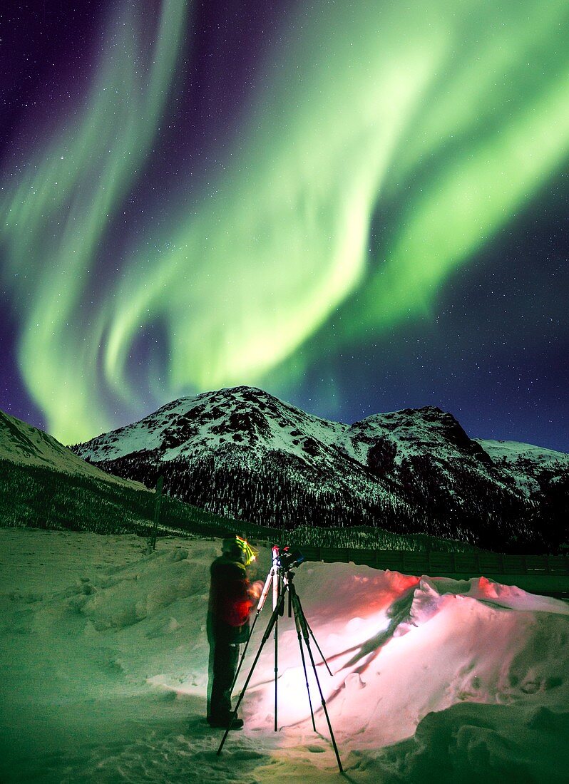 Photographer and the aurora in Alaska