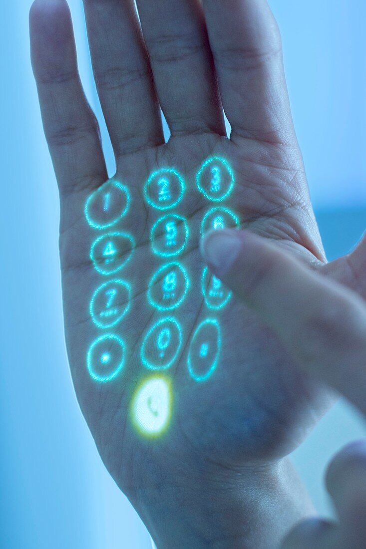 Mobile phone keypad projected on hand