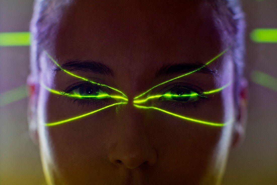 Woman with green lights on face