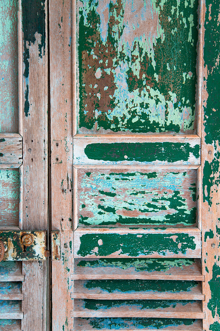Vintage wooden door with peeling paint