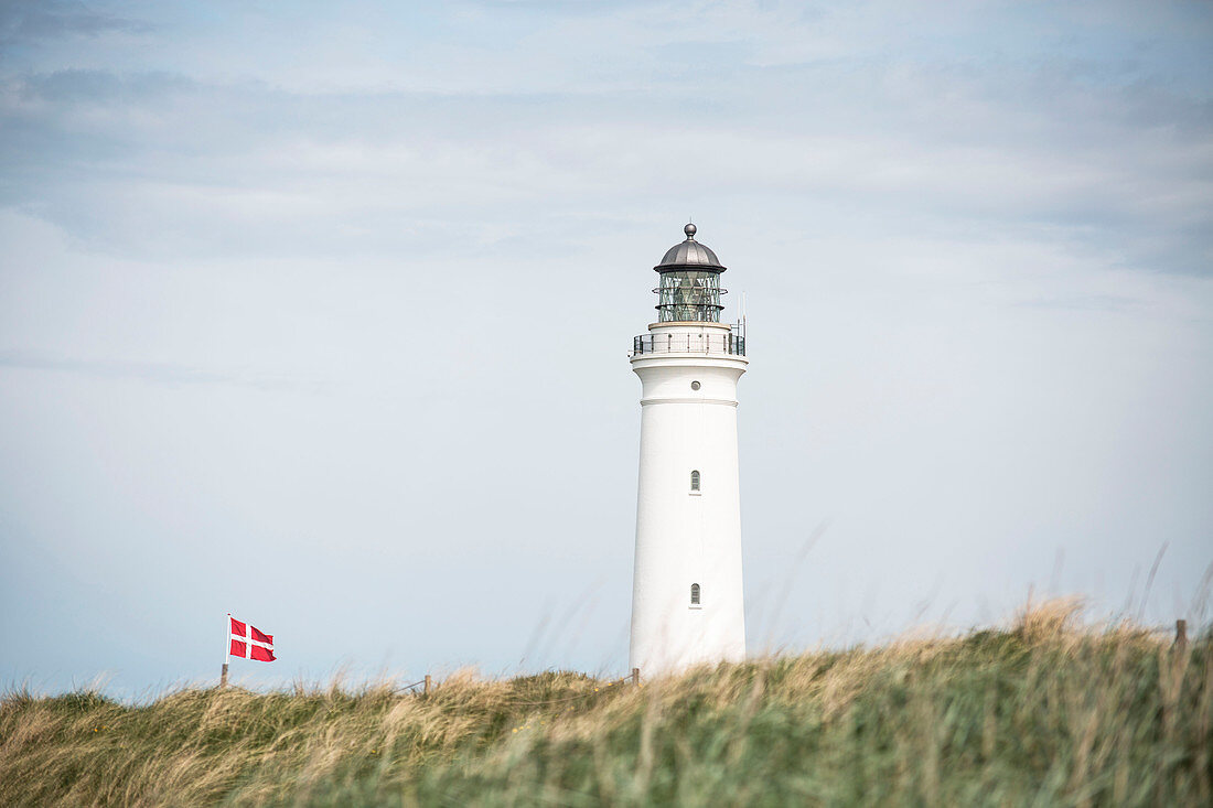 Lighthouse and Danish flag