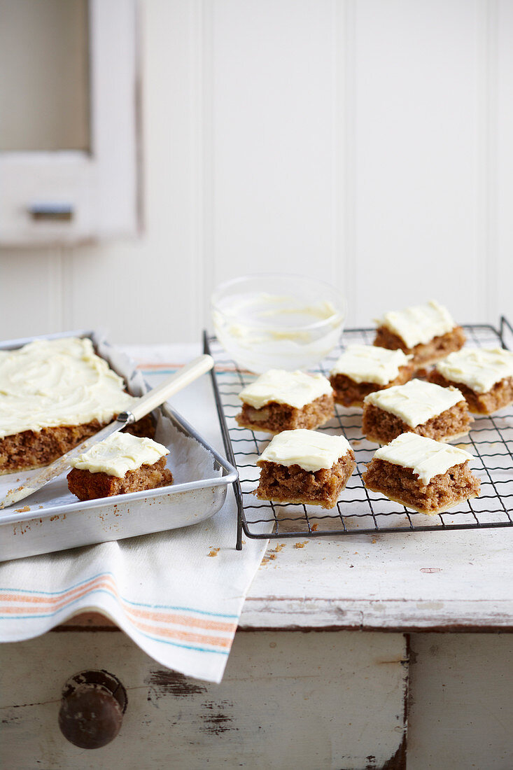 Hummingbird Cake (banana-pineapple cake) from the tray with cream cheese frosting