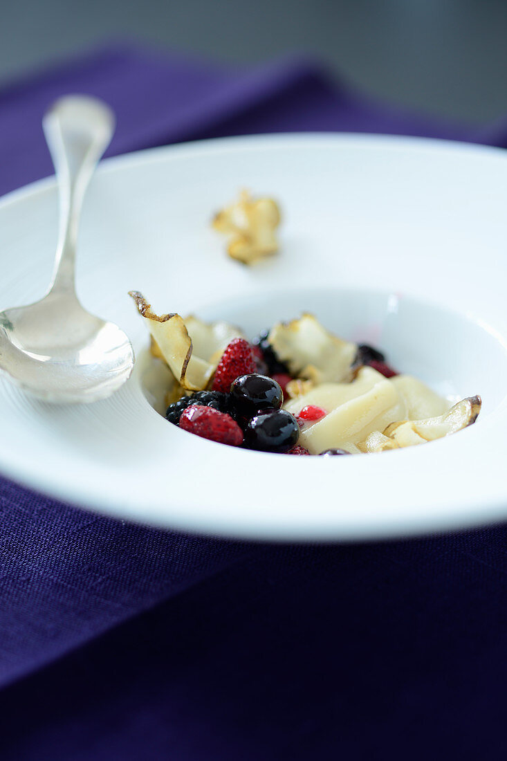 Jerusalem artichoke cream with crispy bits and red fruits