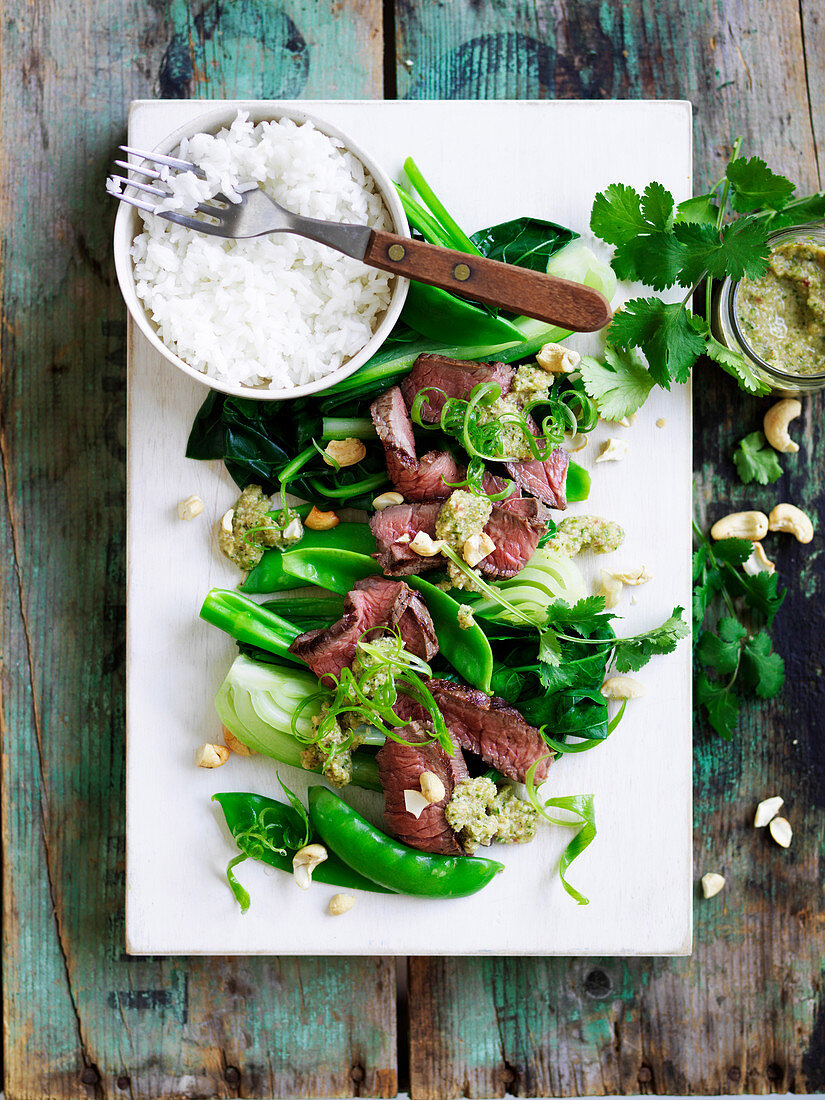 Steak with cashews nam jim and asian greens