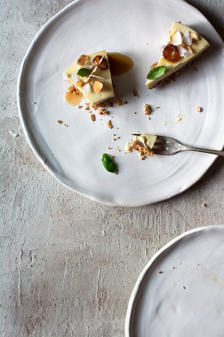 Two pieces of raw lemon and basil tart