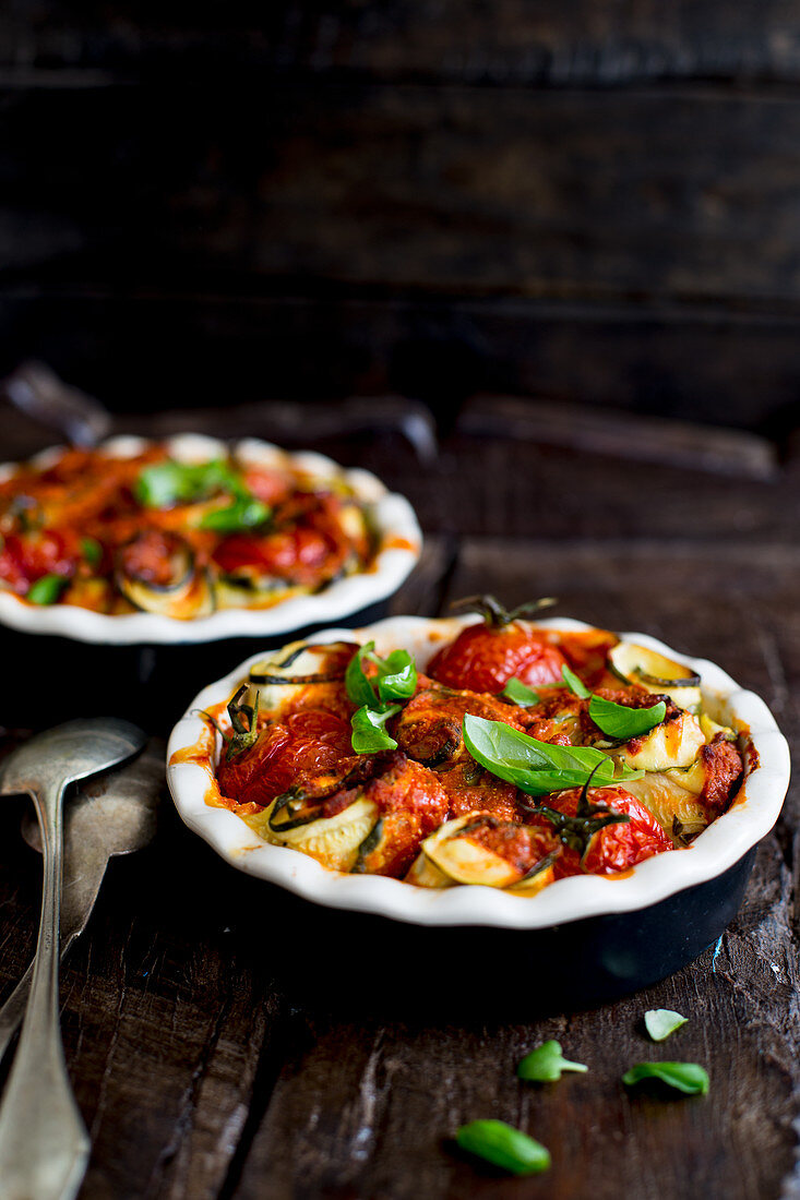 Slices of courgette rolled around tomatoes and basil