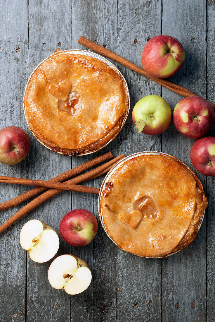 Apple pies with fresh apples and cinnamon