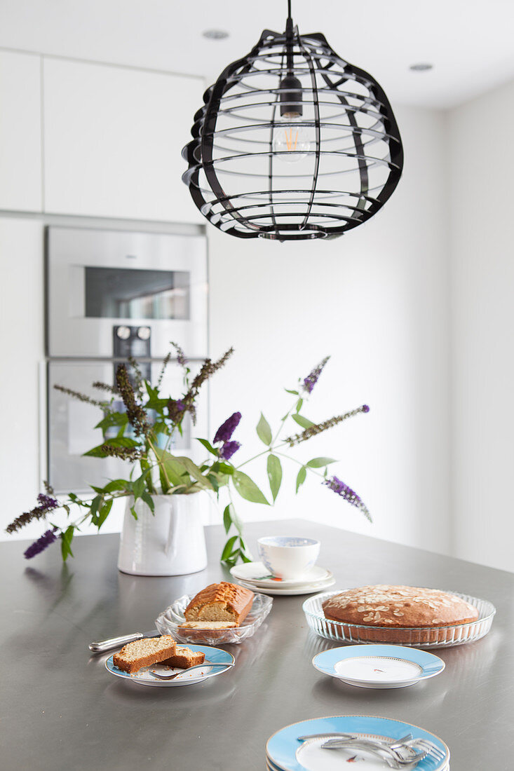 Cake and flowers on dining table