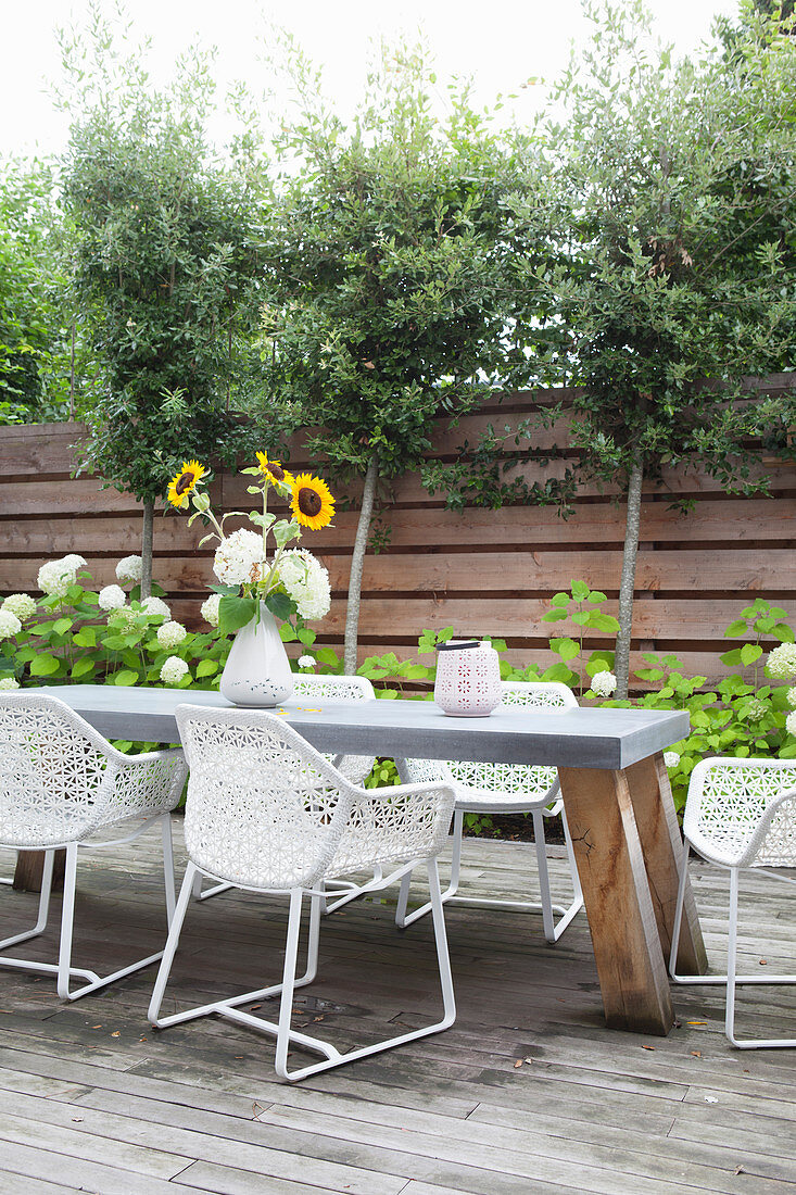 Table and designer chairs on terrace