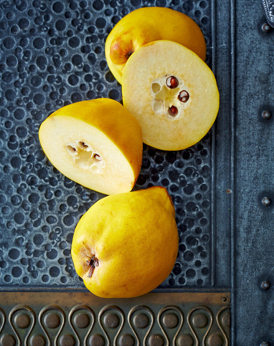 Quinces, whole and halved