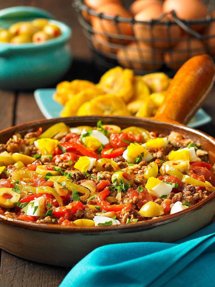 Spicy minced beef hash with egg and olives (Cuba)