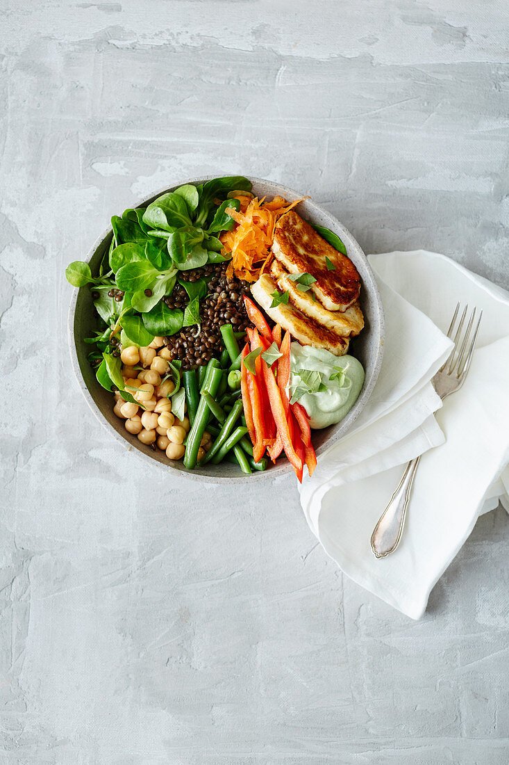 Lentil and halloumi bowl with vegetables