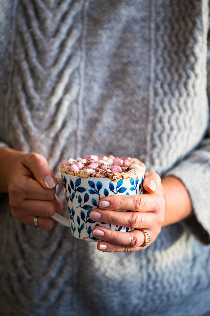 Hot chocolate with Marshmallows in hand