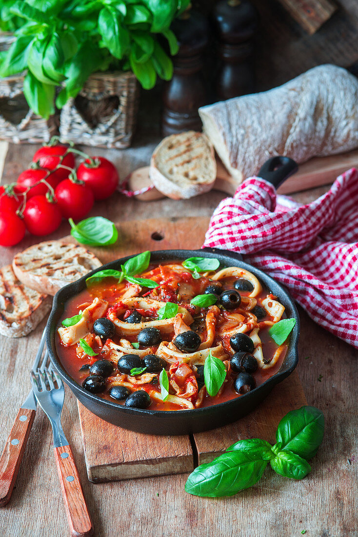 Calamari with tomatoes and olives