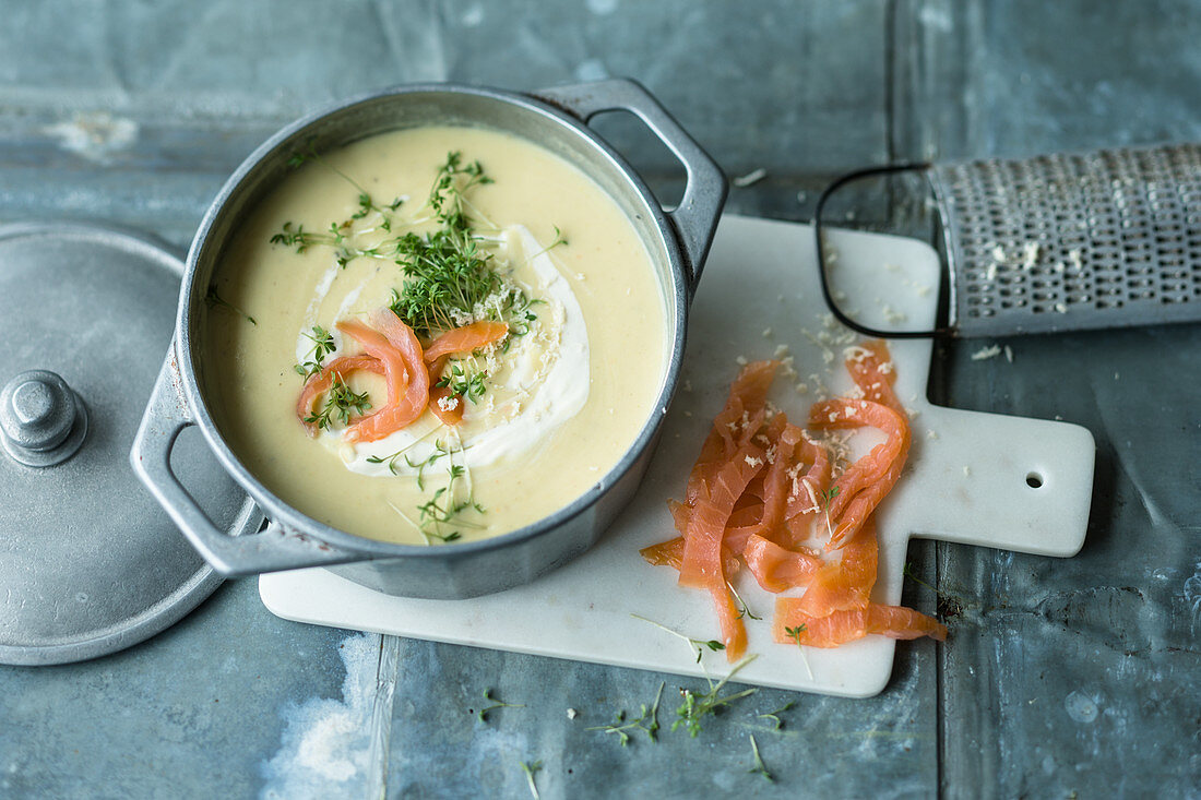 Potato soup with salmon, horseradish and cress