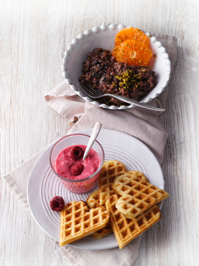 Chocolate rice pudding with clementines, and millet waffles with raspberry quark