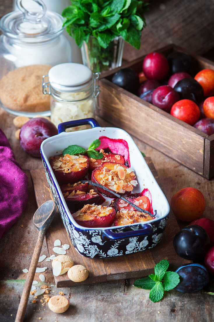 Baked plums with amaretti cookies