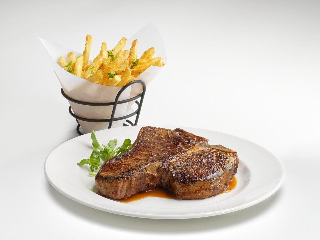 A porterhouse steak with french fries