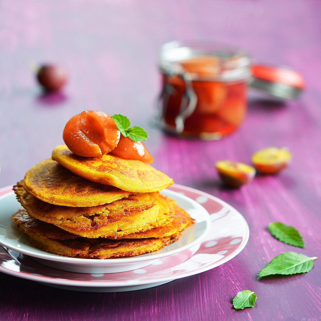Vegan pumpkin fritters with plum compote