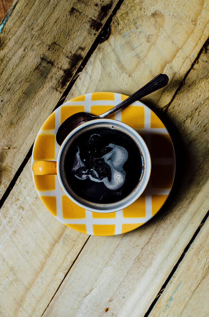 Black coffee in cup and saucer