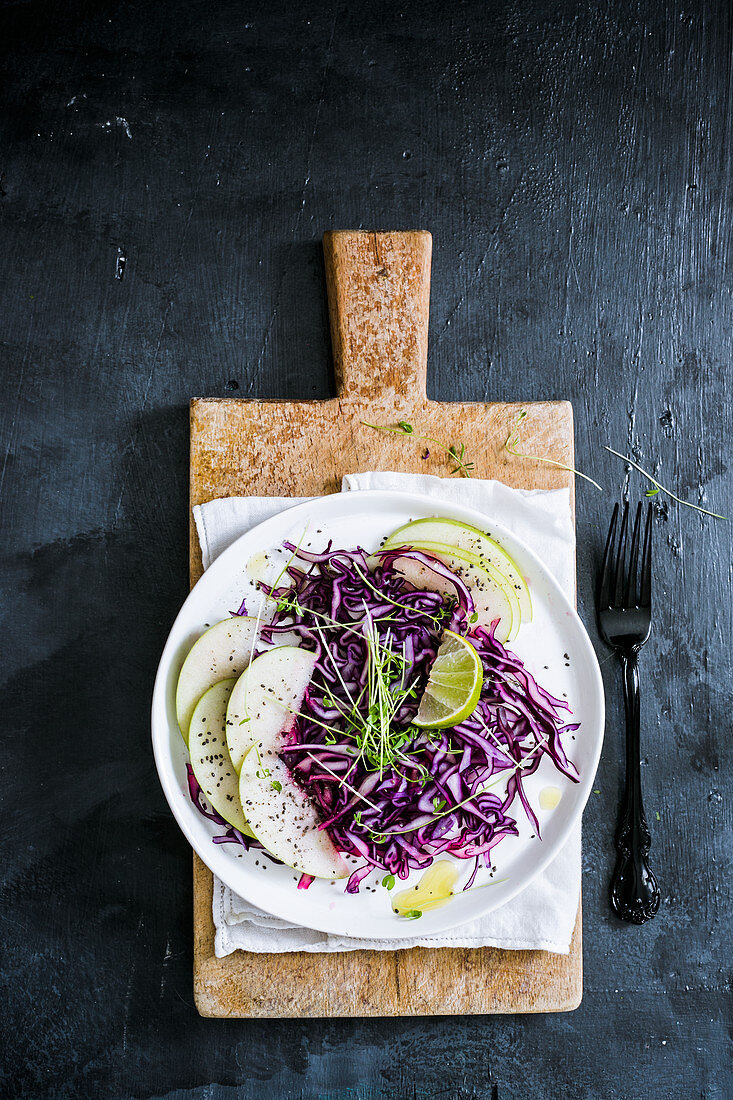 Red cabbage salad with pears and sprouts