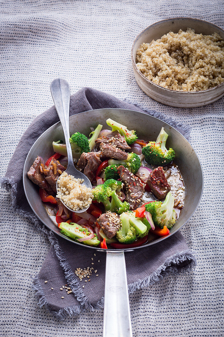 Fried beef with quinoa and broccoli