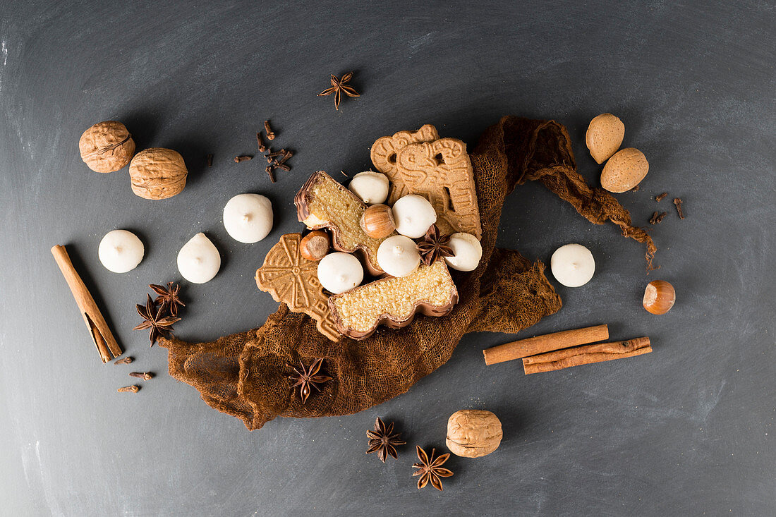 Various different Christmas biscuits, spices and nuts