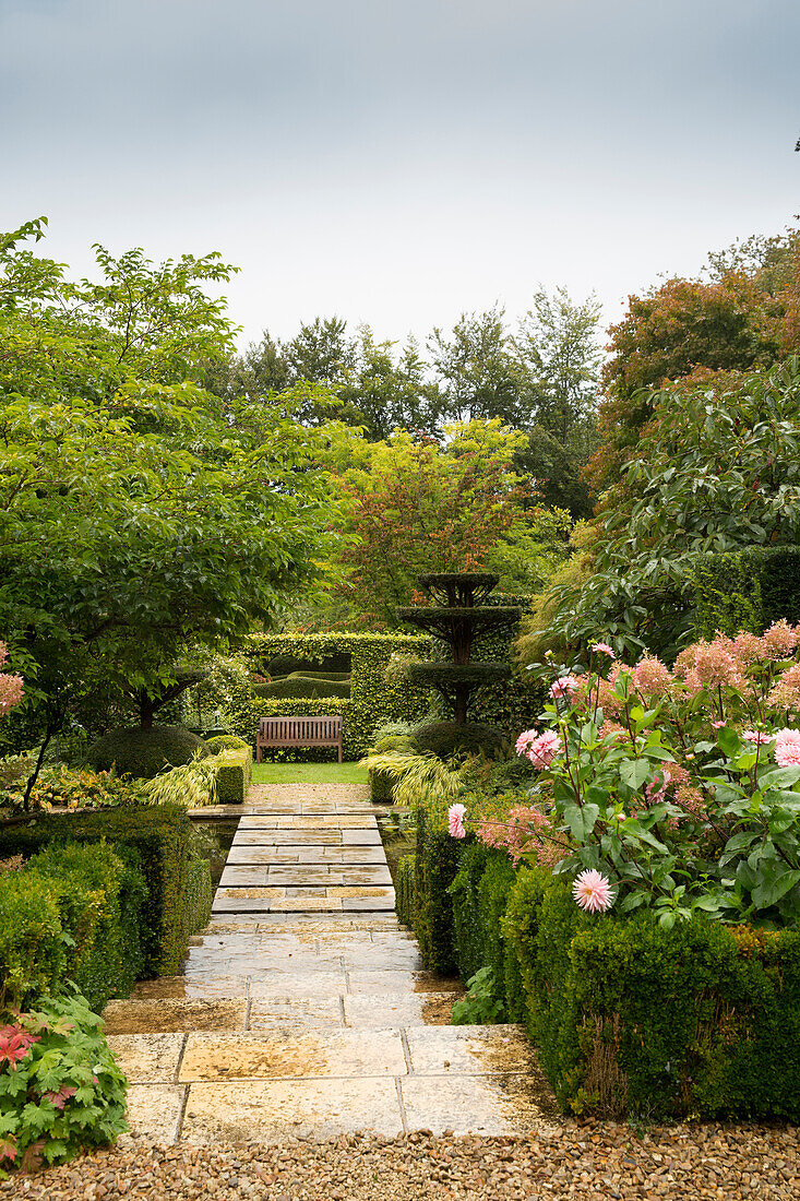 Steps leading to bench in garden (Les Jardins de Castillon, France)