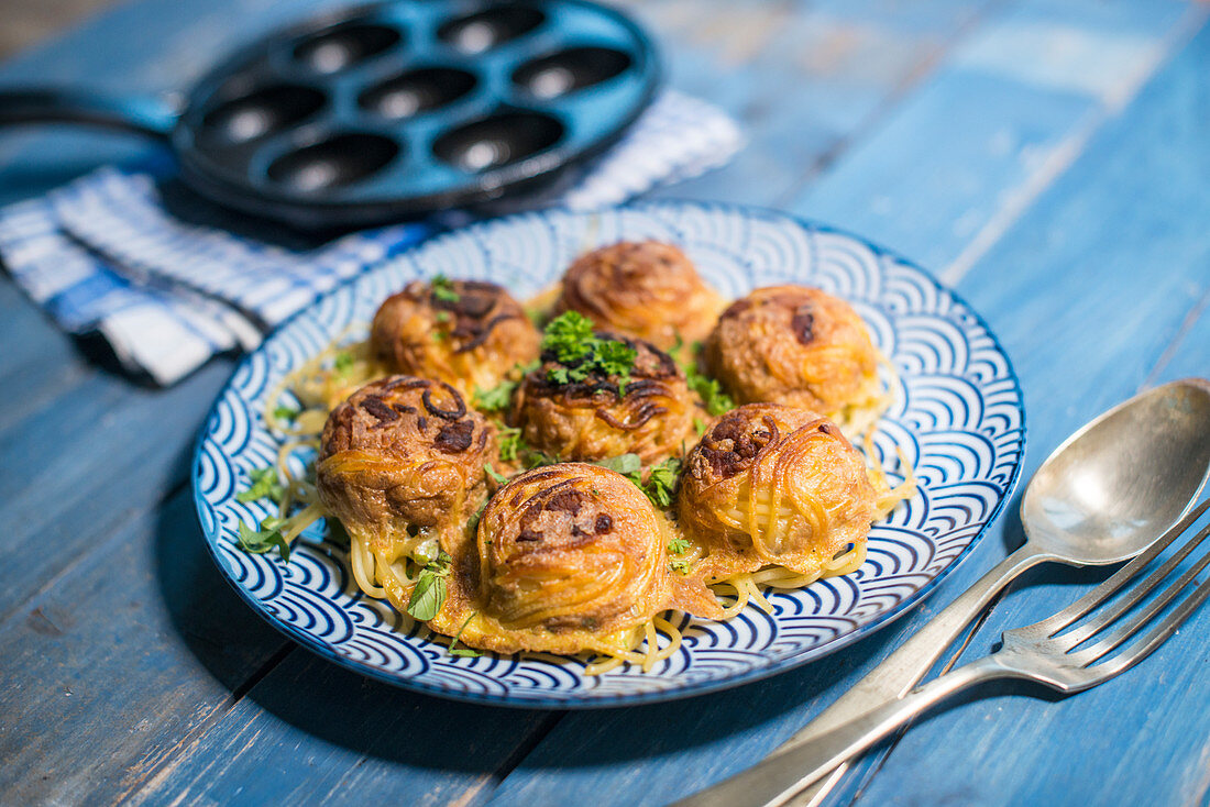 Spaghetti cooked in a doughnut pan