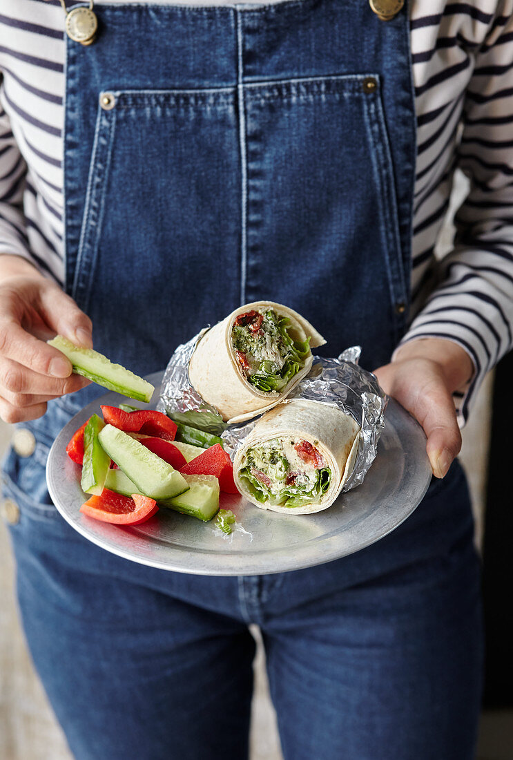 Italian chicken salad wraps served with vegetable sticks