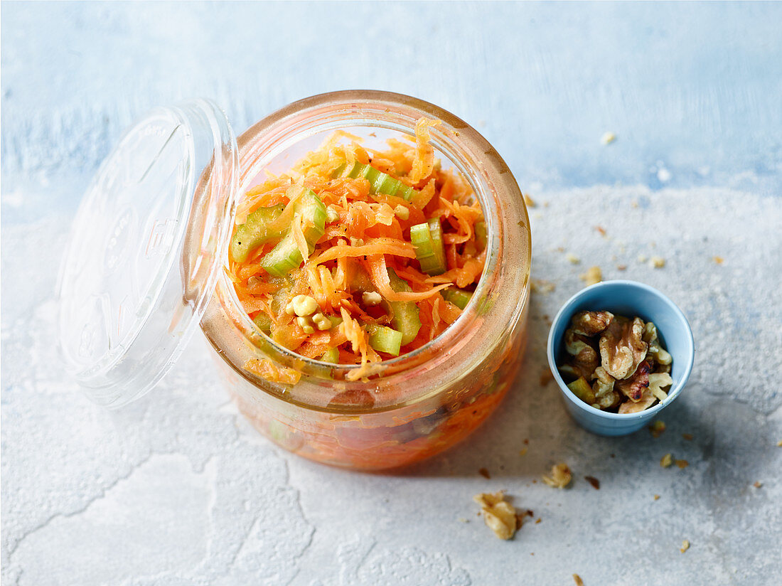 Carrot salad with celery, ginger and nuts to take away