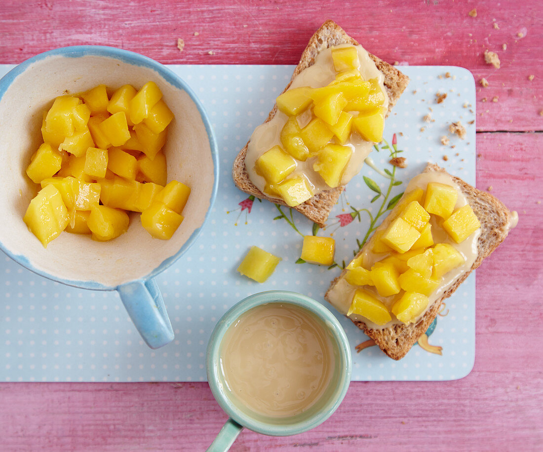 Wholemeal toast with almond butter and diced mango