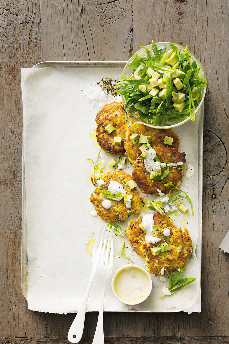 Zucchini, tuna and chickpea fritters with avocado and mint salad