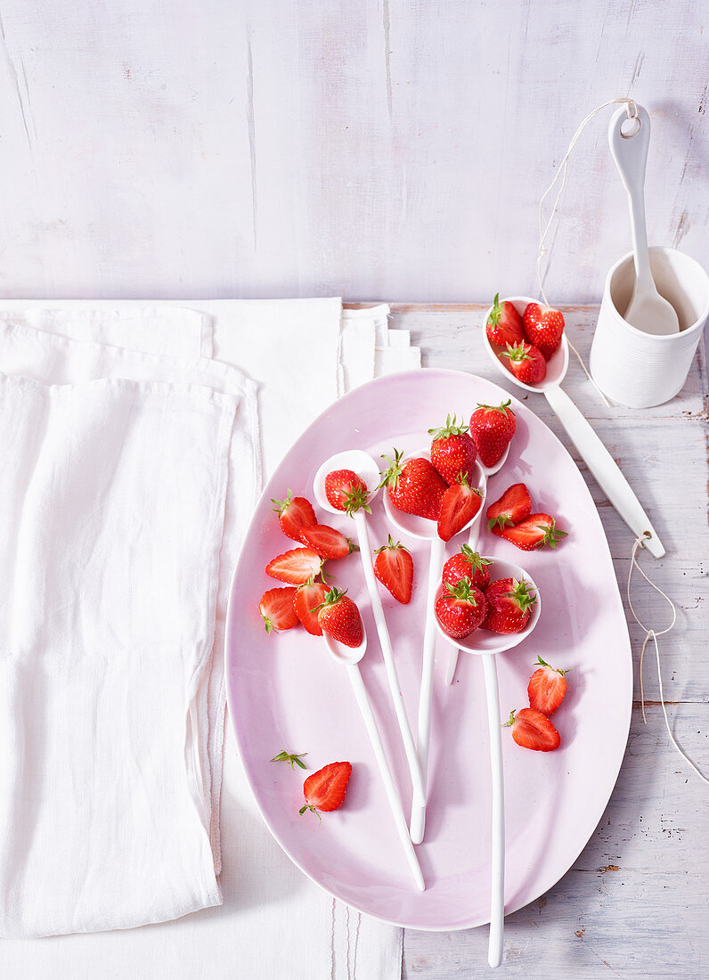 A strawberry still life with a white porcelain plate