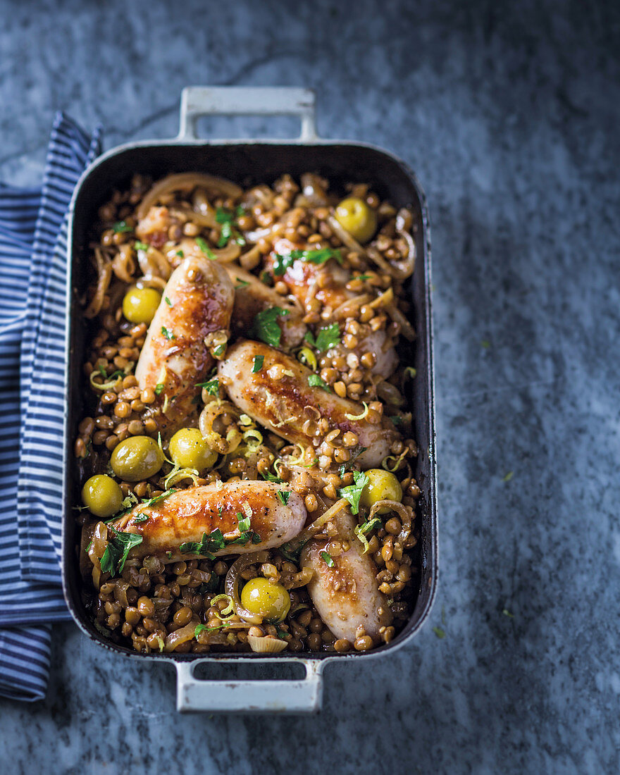 Sausages with braised lentils, lemon and green olives