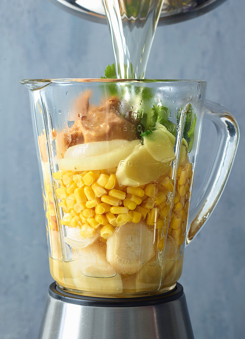 Ingredients for sweetcorn and peanut soup in a blender