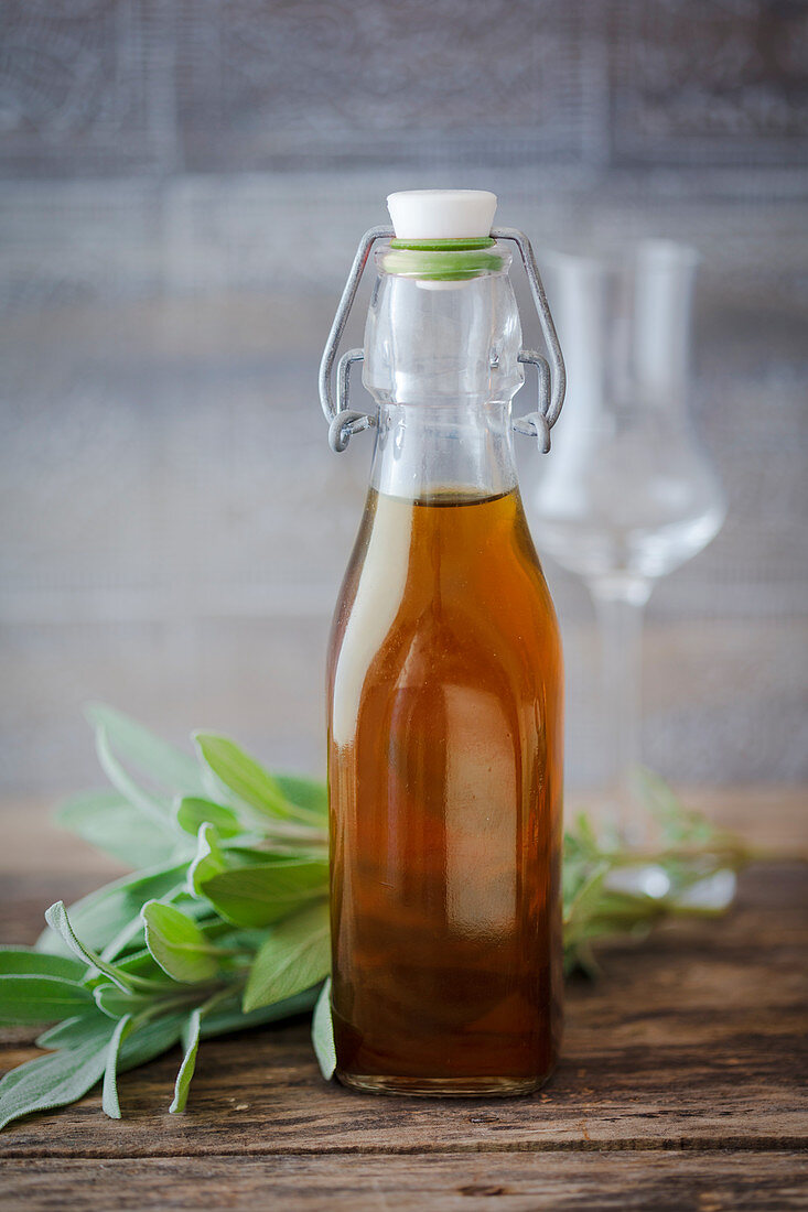 Sage liqueur in a flip-top bottle