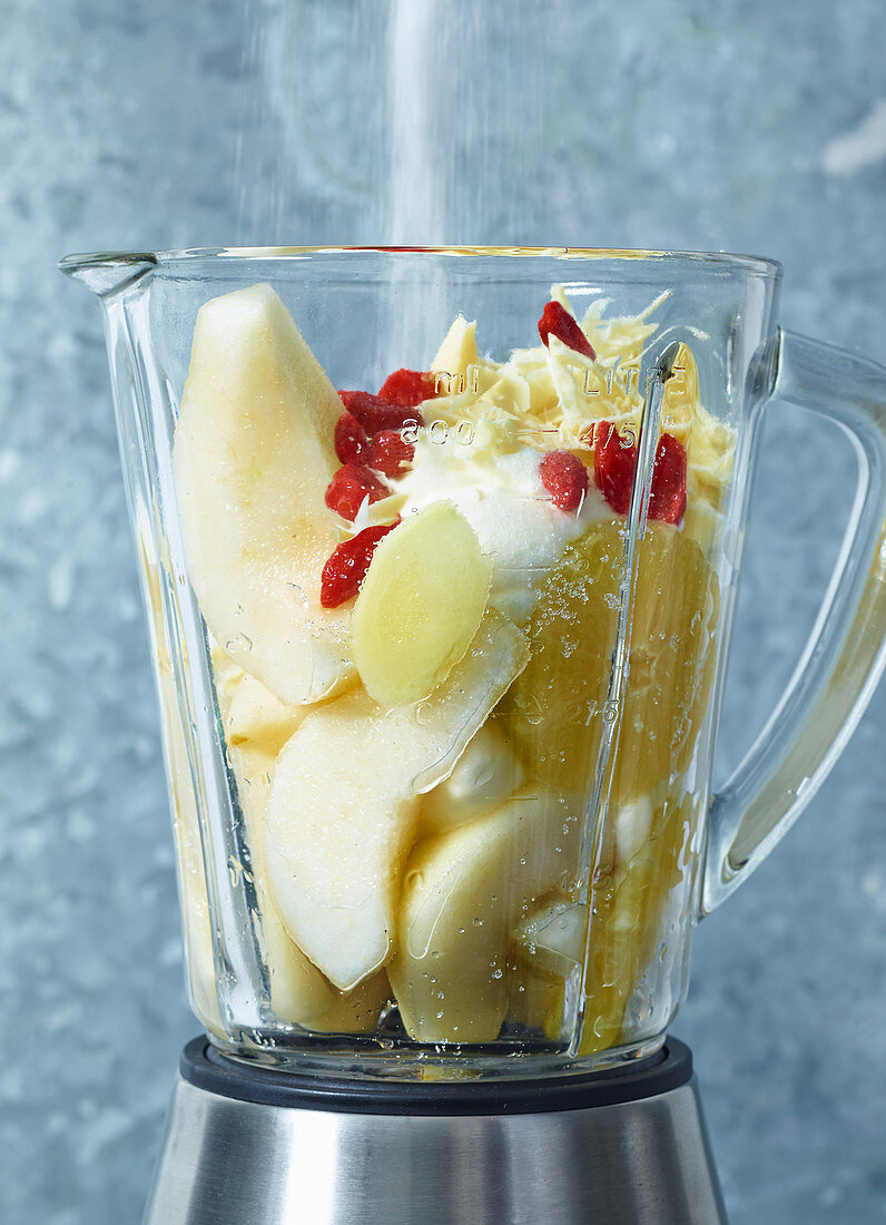 Ingredients for pear and chocolate cream in a blender