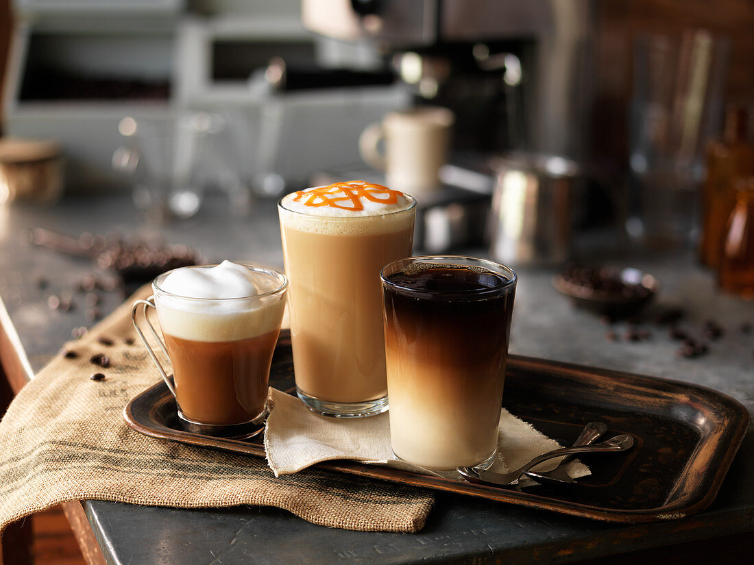 Various coffee drinks on a tray