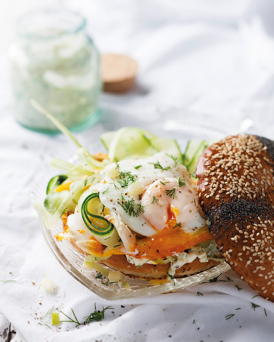 A bagel with marinated haddock and cucumber and egg