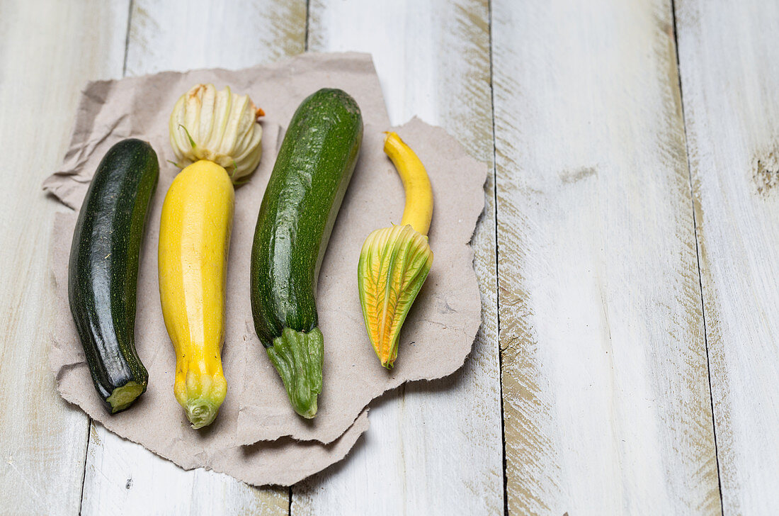 Courgette and courgette flowers on paper