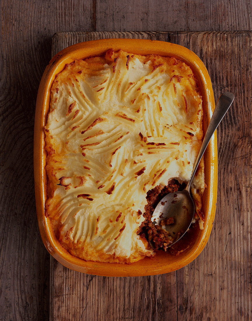 Cottage Pie in Baking Dish with Serving Spoon