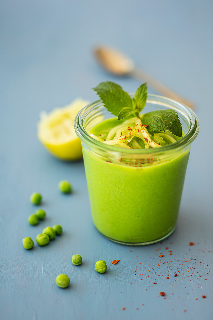 Cold pea soup with mint, lime juice and cucumber noodles (vegan)