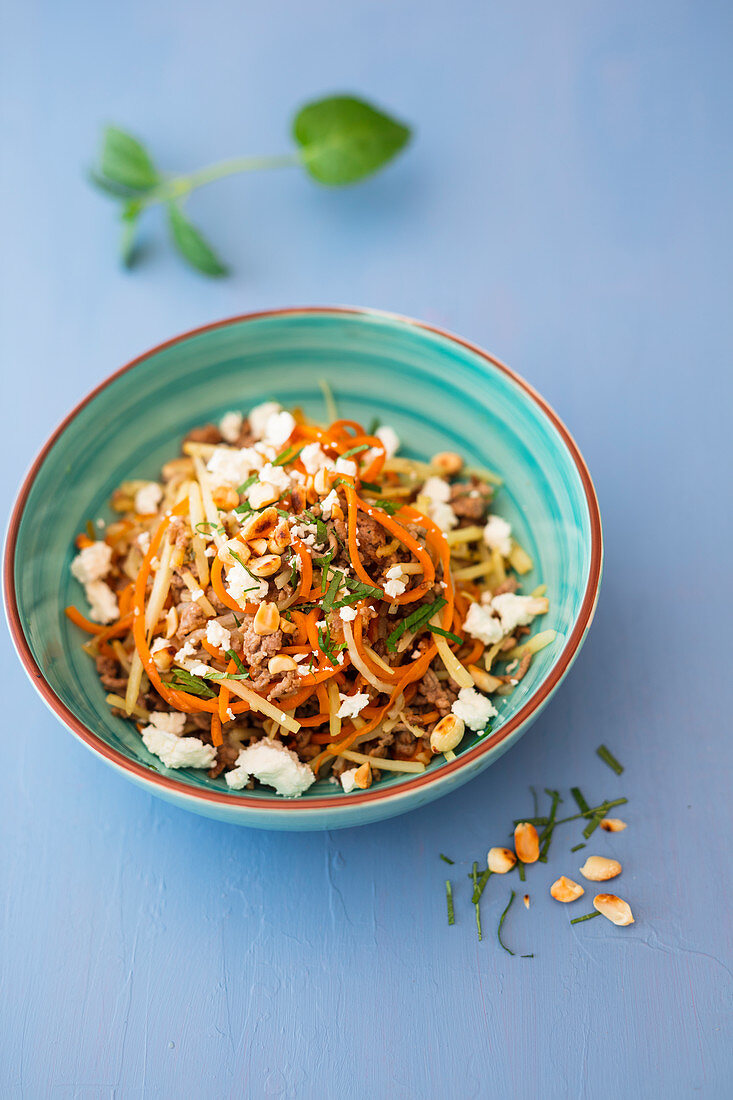 Carrot and parsnip noodles with minced meat, mint and feta cheese