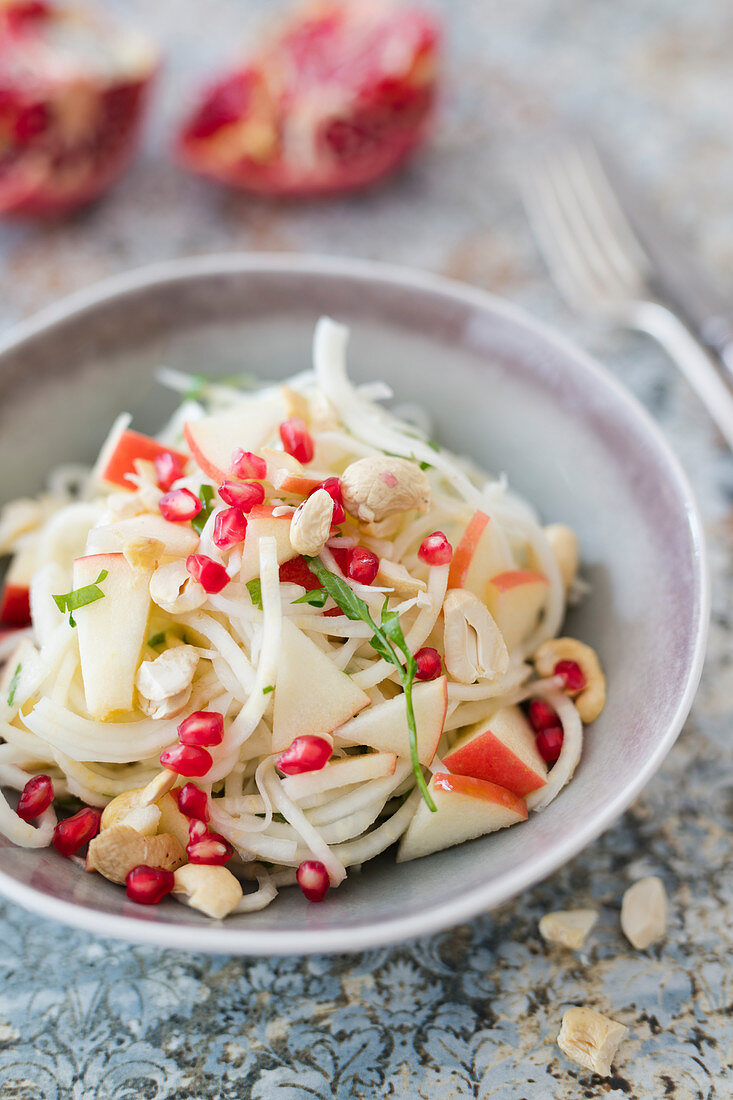 Celeriac salad with apples, cashew nuts and pomegranate seed (vegan)
