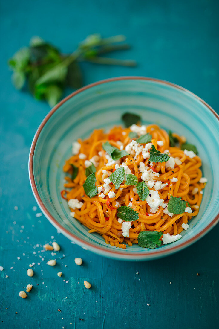 Sweet potato spaghetti with chilli, feta cheese and mint