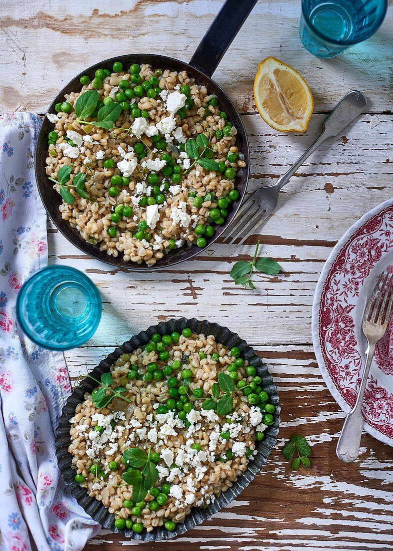 Barley risotto with peas, spring onions, feta cheese and lemons