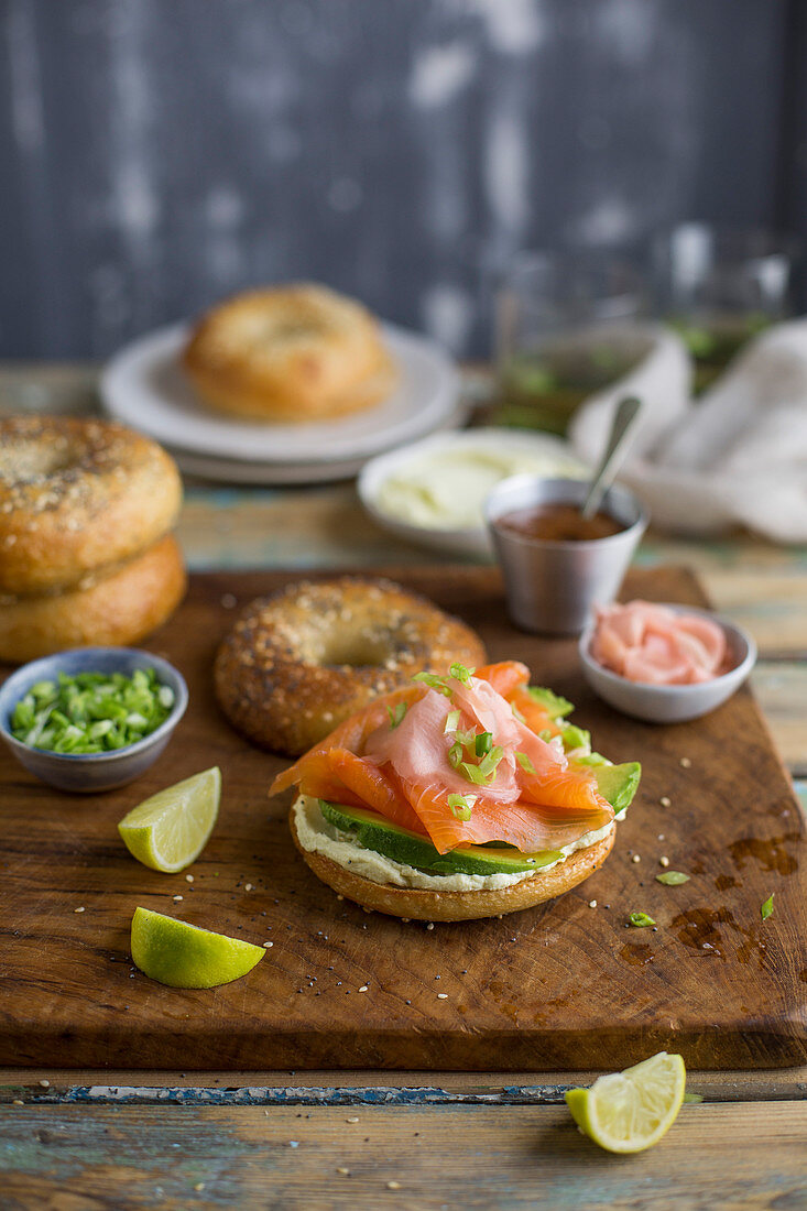 A bagel with salmon, avocado and cream cheese