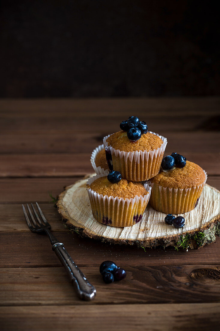 Blueberry muffins on a bark disc